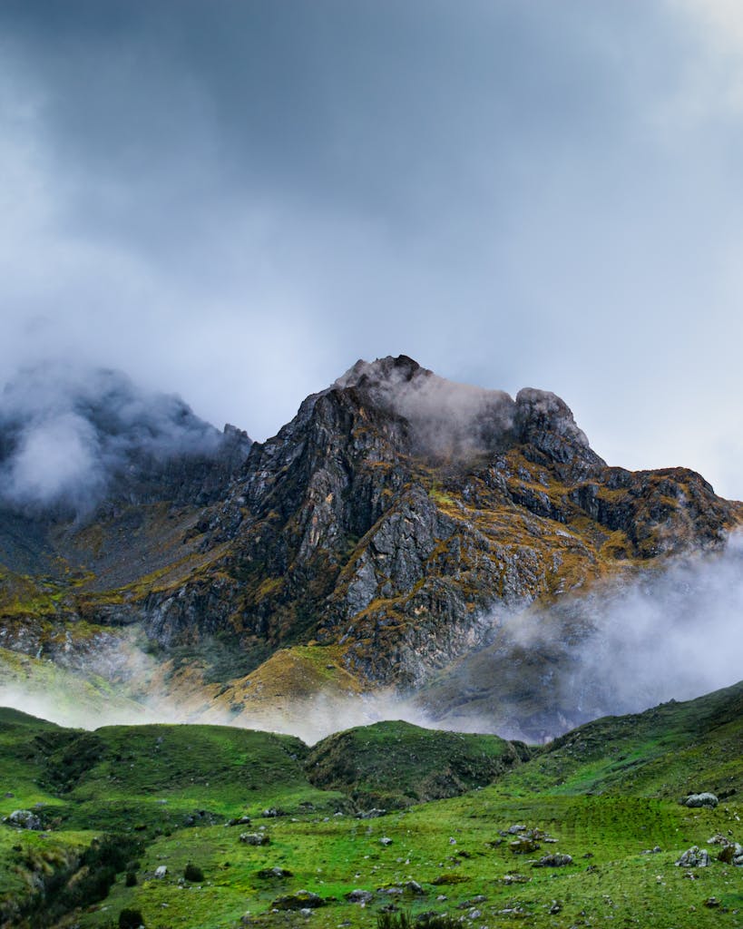 Stunning view of the Andes Mountains in Ollantaytambo, Peru, shrouded in mist.